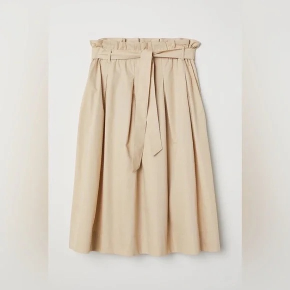 Calf-length skirt, woven cotton-blend. Pleats at top,  tie belt, side pockets